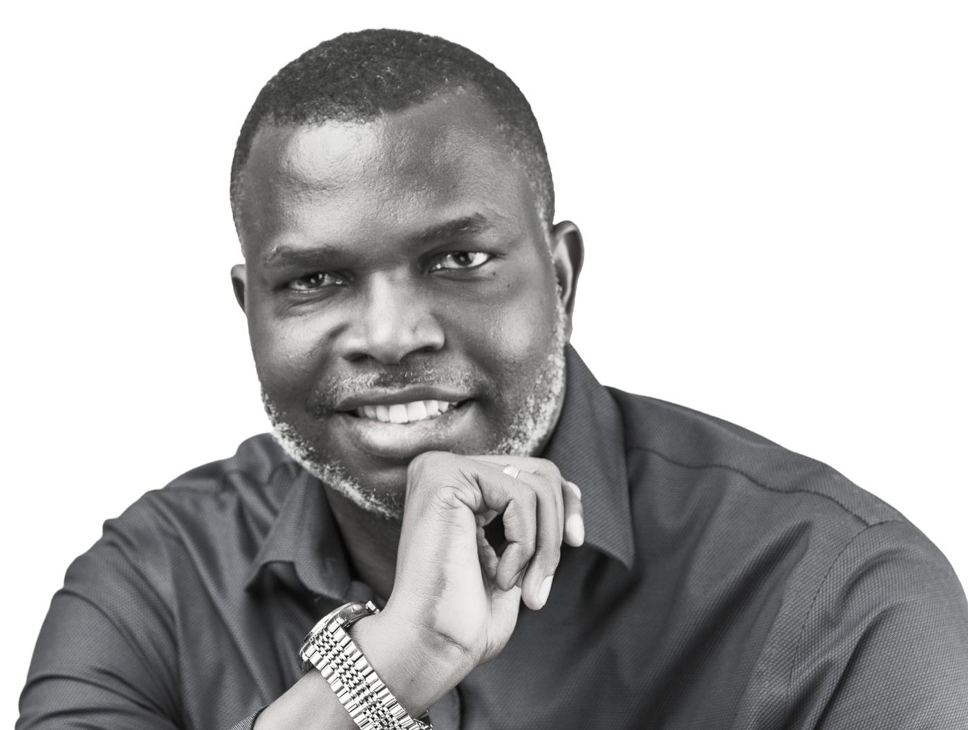 Dr Solomon Kpandei, smiling, chin resting on his hand